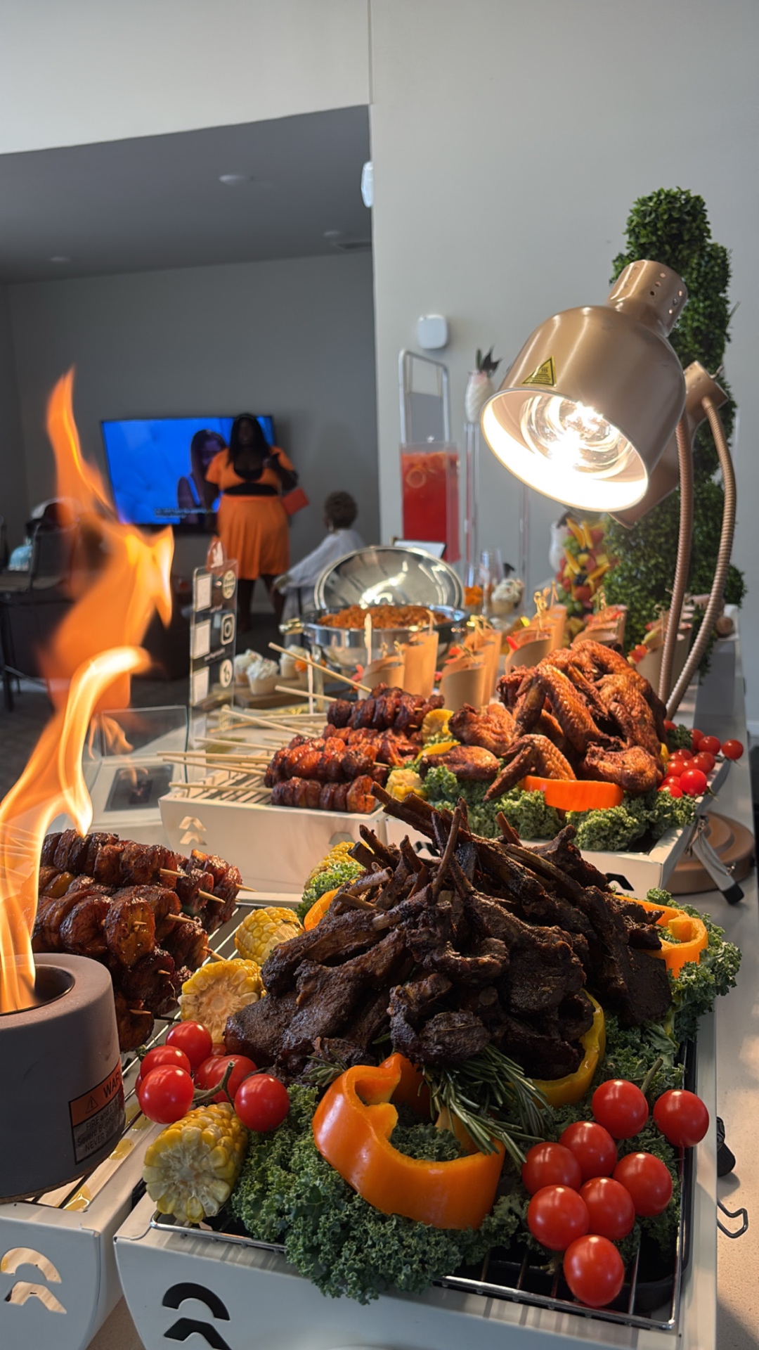 Live-flame luxury buffet display with ribs, wings and skewers, Moorhead MN event catering